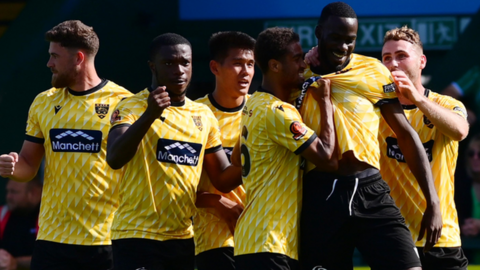 Maidstone United's players celebrate scoring against Yeovil in August 2023