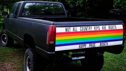 Tailgate in rainbow colours says 'Not all country boys are bigots - Happy Pride month'
