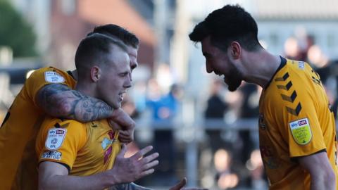 James Waite celebrates with his Newport County team-mates