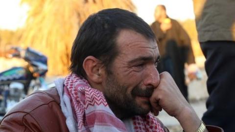 A Syrian man cries after his evacuation from eastern Aleppo. Photo: 15 December 2016