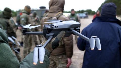 dji mavic with soldiers