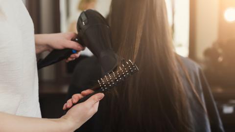 Hairdresser with client