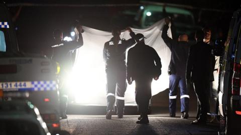 Police attend the scene of the shooting in north-west Sydney