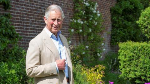 King Charles in the gardens of his Gloucestershire home