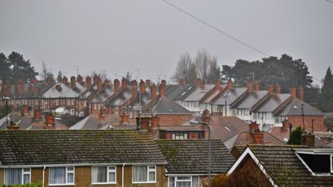 A grey sky above rooftops in Northampton