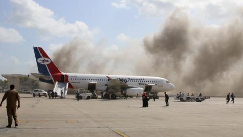 Smoke rises from Aden's airport after an explosion on 30 December 2020