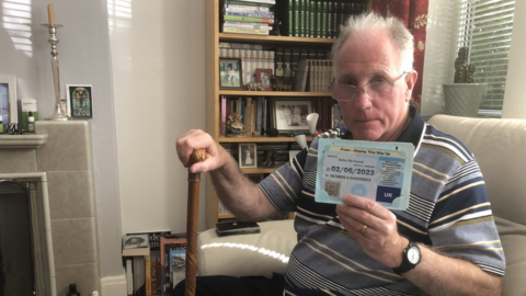 Trefor Jones holding his expired blue badge