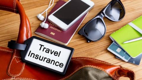 Travel insurance tag on bag with belongings