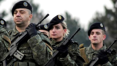 Members of Kosovo's security forces parade a day before parliament's vote on whether to form a national army, in Pristina, Kosovo, December 13, 2018