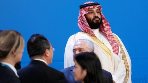 Saudi Crown Prince Mohammed bin Salman looks out as leaders arrive for a family photo at the G20 in Buenos Aires