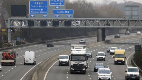 Cars on the M3 smart motorway near Longcross in Surrey