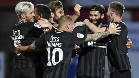 Northampton Town celebrate a goal against Cheltenham