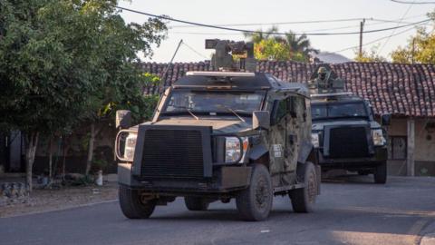 Mexican Army vehicles patrol the streets in Aguililla, Michoacán state, Mexico, on 9 February.