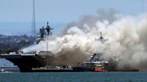 Smoke billowing from the USS Bonhomme Richard