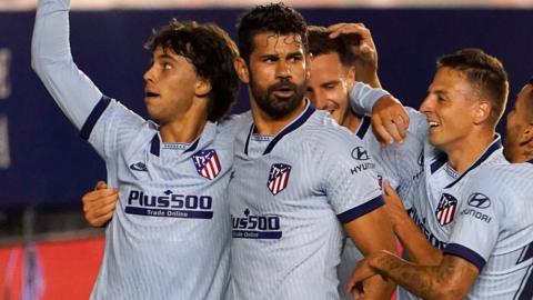 Atletico Madrid players celebrate a goal against Osasuna