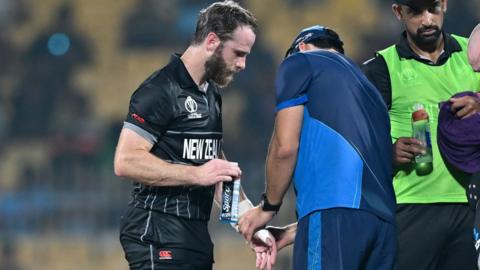 Kane Williamson getting treatment after being hit on the thumb