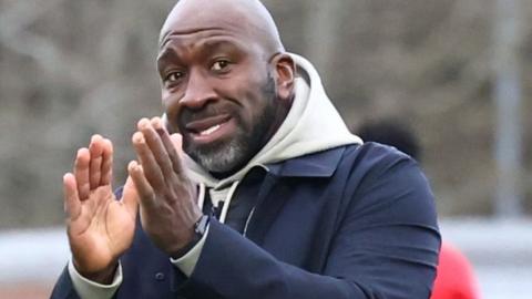 Port Vale boss Darren Moore claps the fans after beating Burton Albion to get his first win in charge