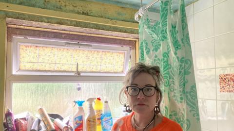 Liz Pannell in her mouldy bathroom in Saltash
