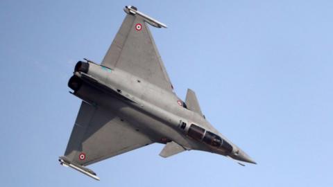 A French Rafale fighter jet performs during the Dubai Airshow on November 12, 201