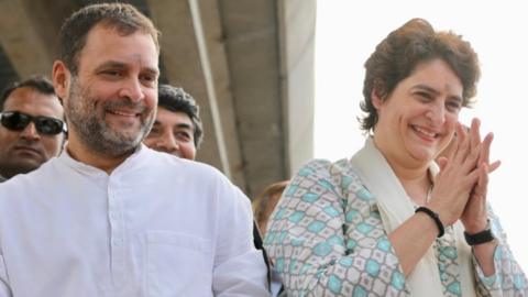 Rahul Gandhi and Priyanka Gandhi greet crowds in Lucknow.