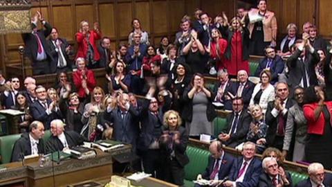 MPs clapping and cheering in Commons