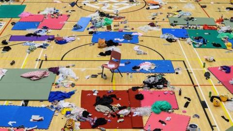 Belongings are left on a basketball court