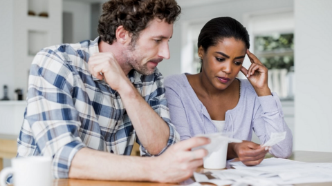 Couple looking at a bill