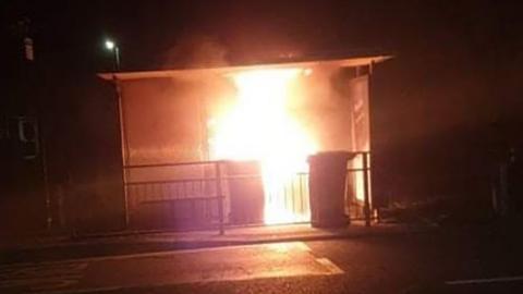 Bus shelter on fire