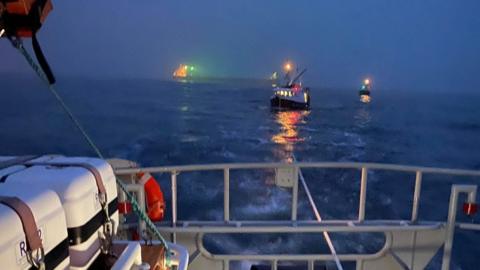 The boat being towed by the RNLI