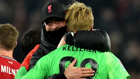 Jurgen Klopp embraces Caoimhin Kelleher after the shootout win over Leicester