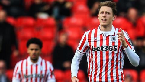 Luke McNally celebrates his goal for Stoke City against Sunderland