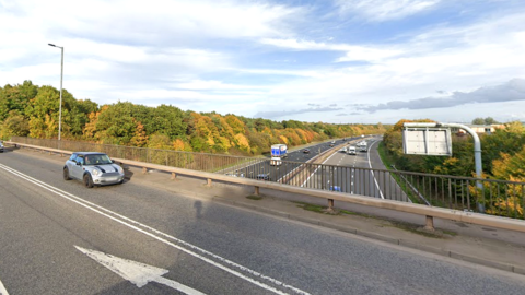 Traffic on the A432 Badminton Bridge looking down to the M4