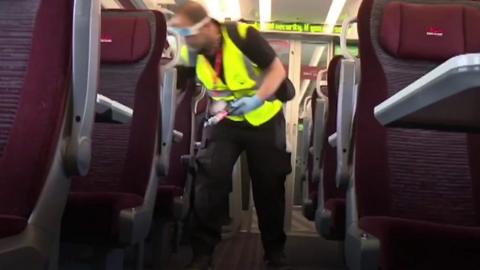 A man cleaning an LNER train