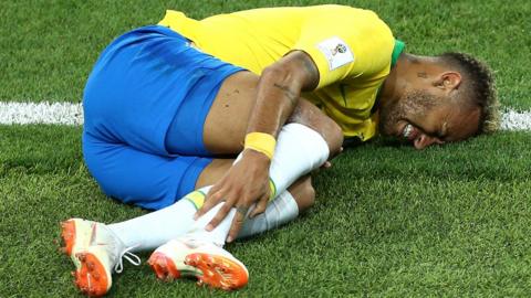 Neymar removed his footwear to display a heavily swollen right ankle after being substituted near the end of Brazil's win over Serbia