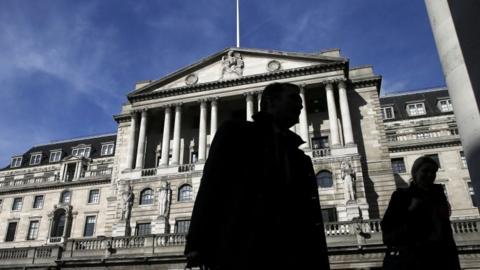 Pedestrians walking past Bank of England