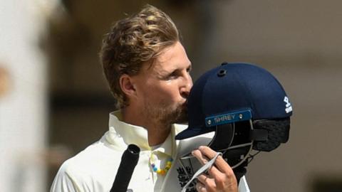 England captain Joe Root kisses his helmet after reaching his century