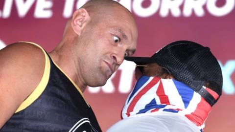 Tyson Fury faces off with Derek Chisora