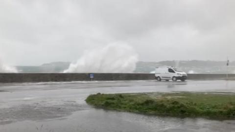 Waves spill on to roads in Guernsey