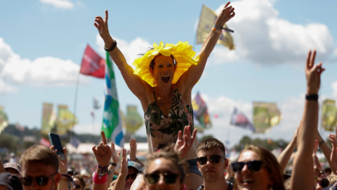 A woman in the crowd at Glastonbury Festival