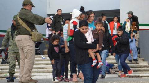 Police instruct a group of Central American migrants intercepted as they crossed the country in the Tamaulipas state, Mexico, 3 February 2018