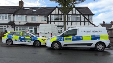 Police vans outside house