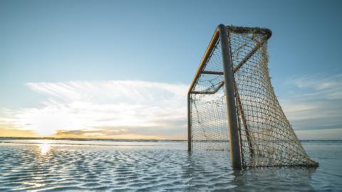 Football goal in water