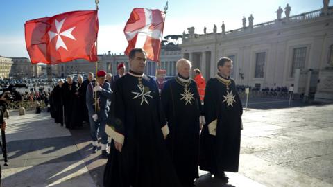 Knights of the Order of Malta walk in procession towards St. Peter's Basilica to mark the 900th anniversary of the Order of the Knights of Malta (February 9, 2013)