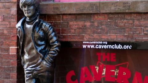 A statue of John Lennon outside of The Cavern Club in Liverpool