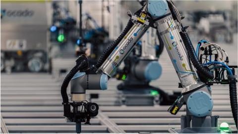 Ocado has added robotic arms to its newest warehouse near Luton.
