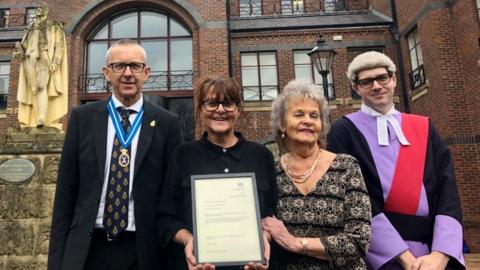 Sharon Walker with her mother Val Walker-Neighbour, Cumbria's High Sheriff Alan McViety and His Honour Judge Richard Archer