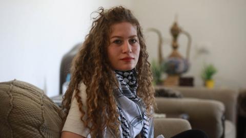 File photo showing Ahed Tamimi at her home in Ramallah, in the occupied West Bank, on 16 May 2021