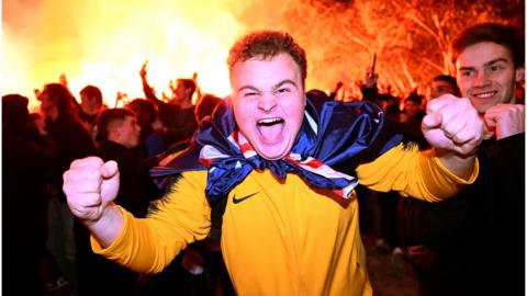 An Australia fan celebrates