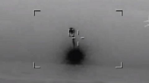 Explosion from drone hitting a missile, in a black and white image