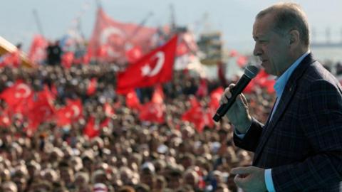Turkish President Tayyip Erdogan addresses his supporters